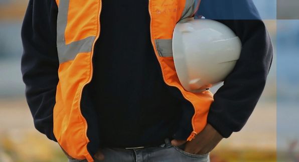 man holding a hard hat. 