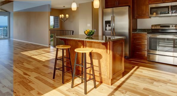 clean, shiny wooden floors in a kitchen. 
