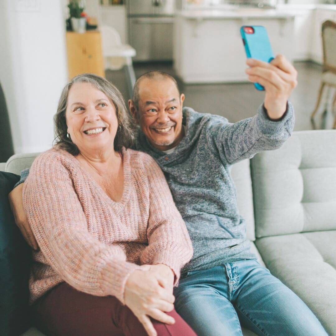seniors taking selfie on couch seniors taking selfie on couch
