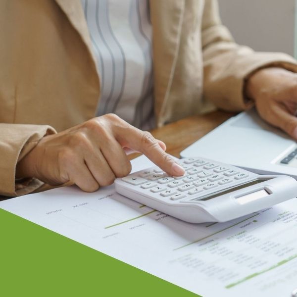 close up of bookkeeper using a calculator