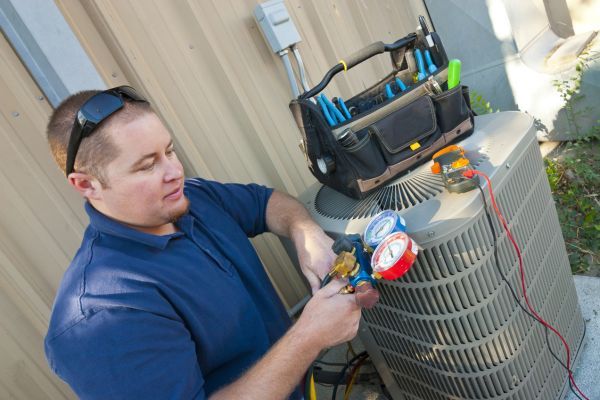 Repair man testing HVAC