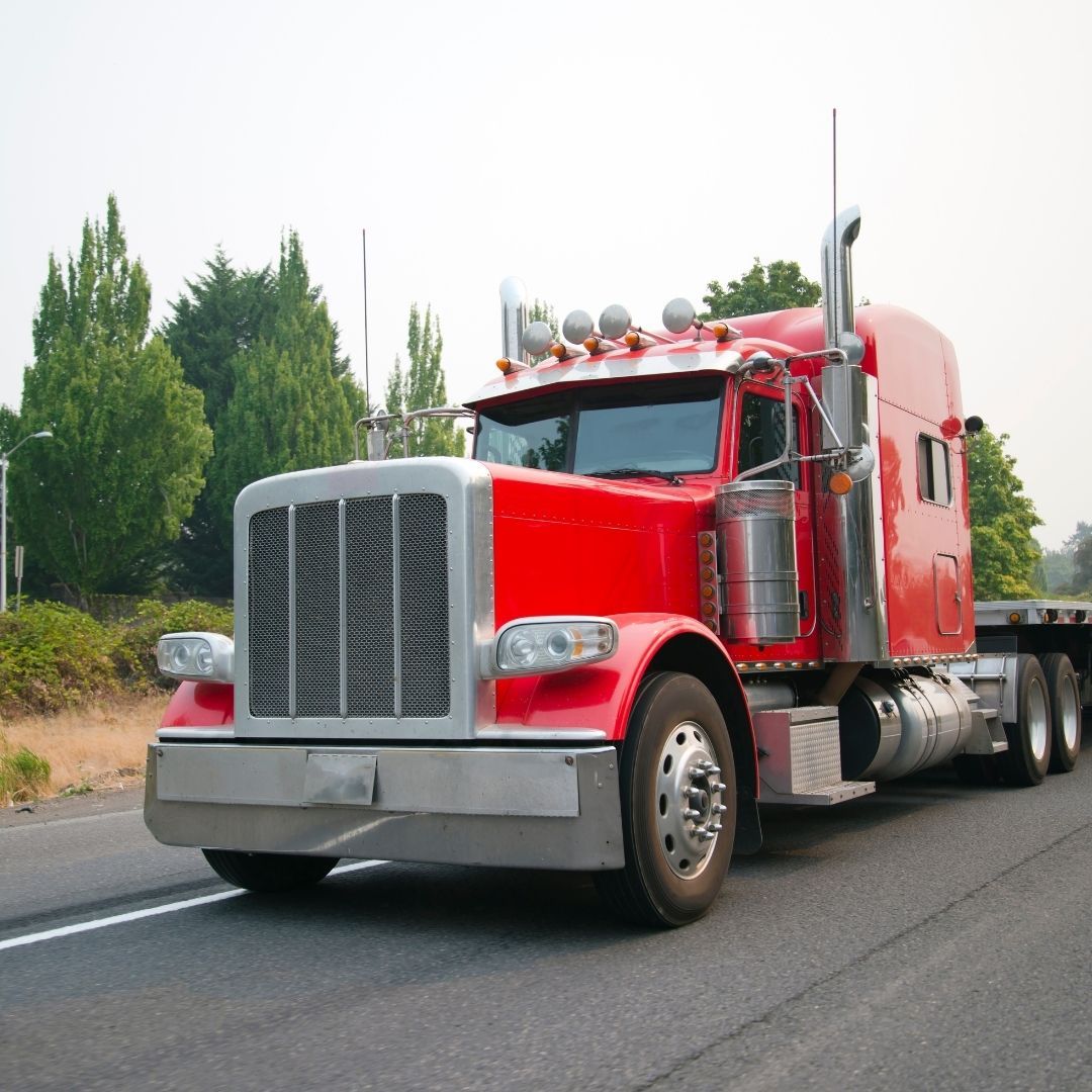 red semi truck on the road red semi truck on the road
