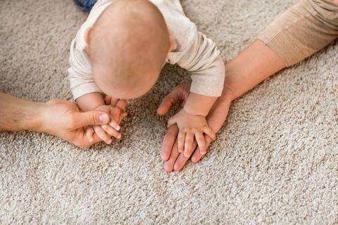 healthy baby on clean carpet