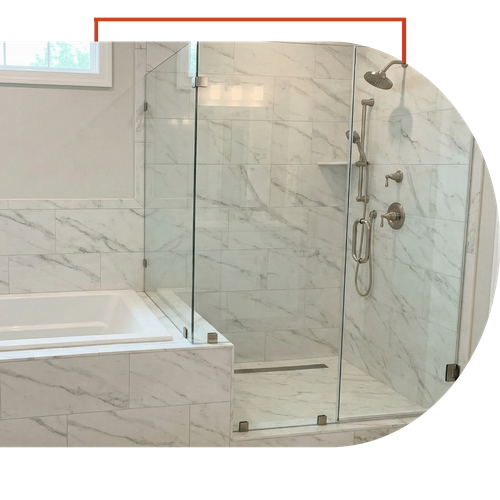 High-end bathroom upgrade in Dawsonville showing a custom marble tile bathtub surround and integrated glass-enclosed shower.