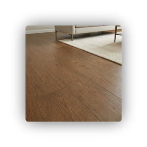 newly installed wide-plank hardwood flooring with a warm brown stain in a residential living room