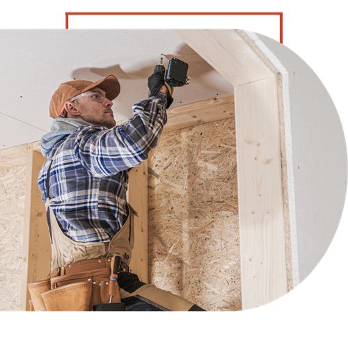 contractor hanging drywall