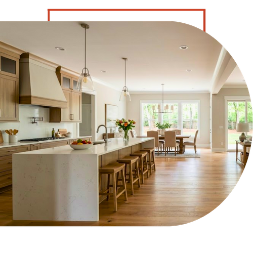 an expansive residential remodel in a Ball Ground, GA home showcasing the seamless flow from a kitchen island across a dining area into a large living room, connected by wide-plank, light oak hardwood flooring