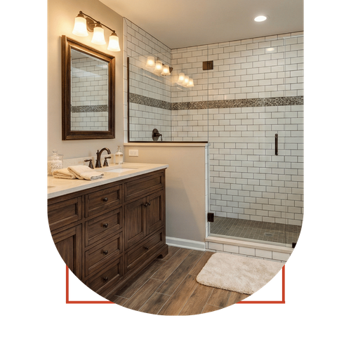 Luxury bathroom renovation in Dawsonville with a double wood vanity, walk-in glass shower with subway tile, and durable wood-look flooring.