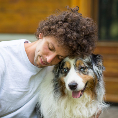 owner hugging dog