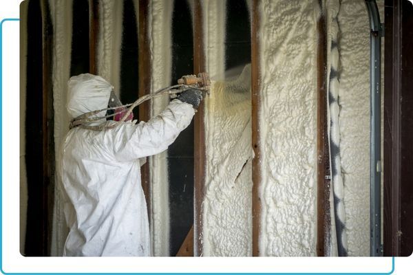 a person adding spray foam insulation to walls Spray Foam.jpg