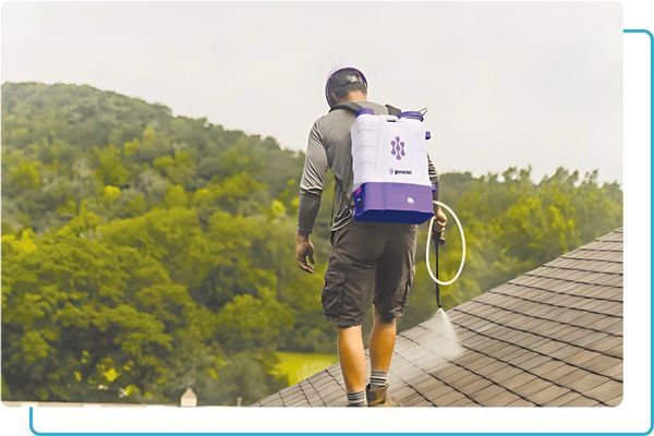 a man spraying GoNano Shingle Saver Roof Rejuvenation (2).jpg
