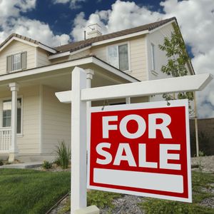 a for sale sign outside of a home Real Estate Icon.jpg