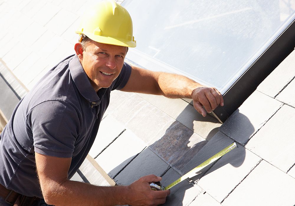Image of a roofer making a repair