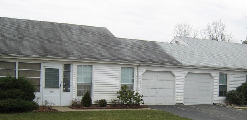 a home in hte middle of getting their roof cleaned