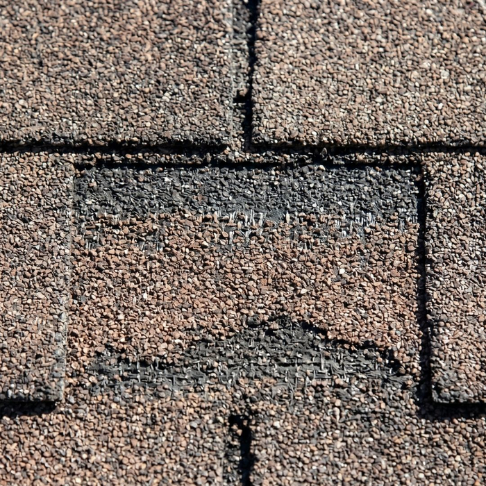 Damaged roof shingles.