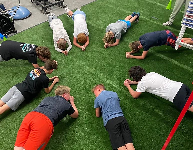 a group of people working with a fitness coach