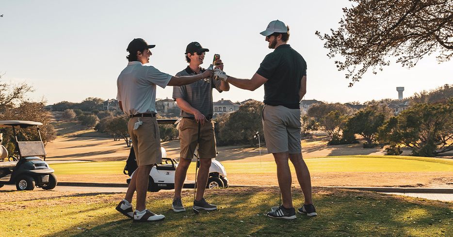 three men playing golf