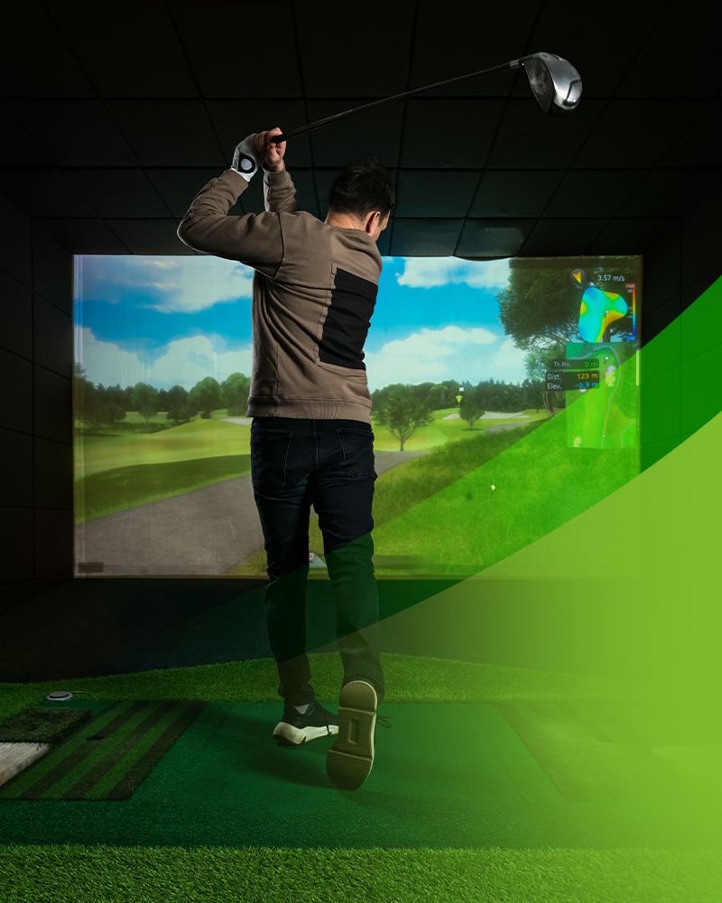 man playing golf in a simulator