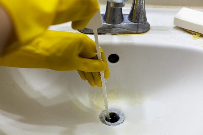 image of cleaning a drain