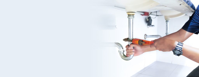 image of a plumber working