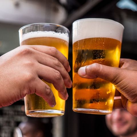 cheers between two people with beers