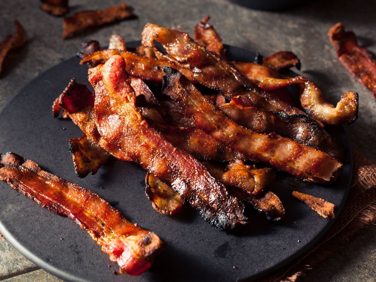 plate of freshly cooked bacon plate of freshly cooked bacon