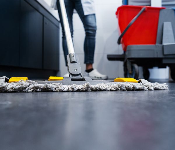 Image of someone cleaning a floor