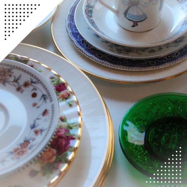 teacups and plates stacked on a table estatesales (1).jpg