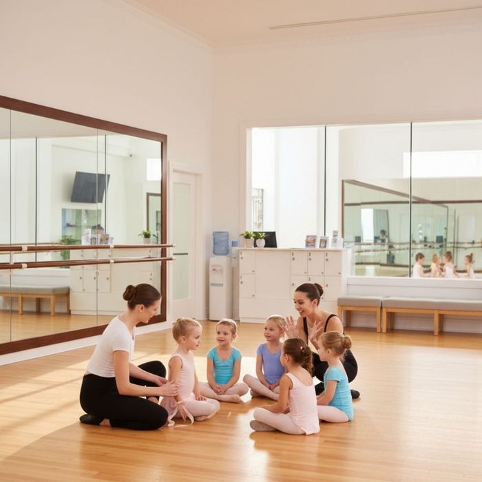 two dance instructors sitting in a circle with students