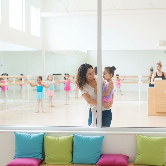 a dancer instructor holding on of her dance students