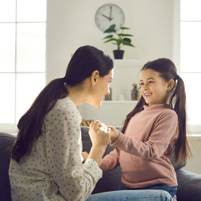 a mother talking with her daughter