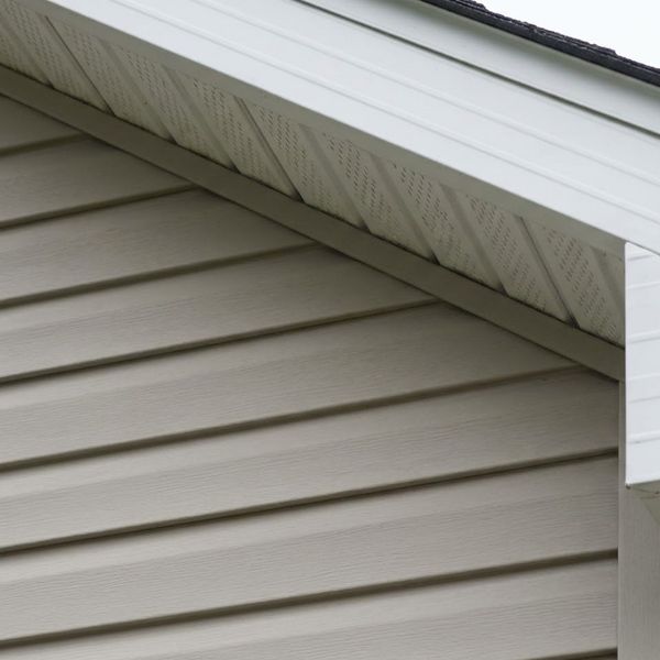 A close inspection of vinyl siding and roof edge A close inspection of vinyl siding and roof edge