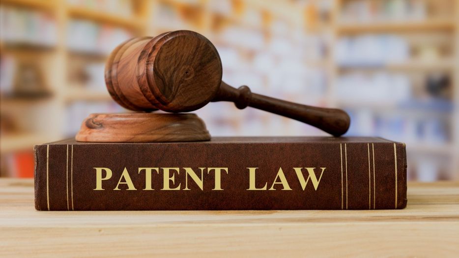 patent law book and gavel