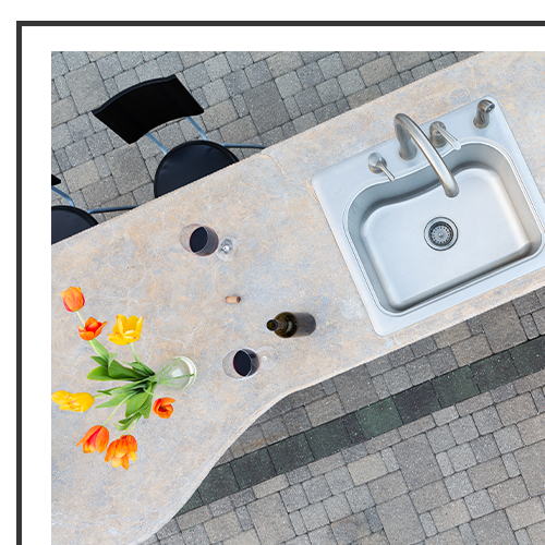 An outdoor kitchen counter and sink