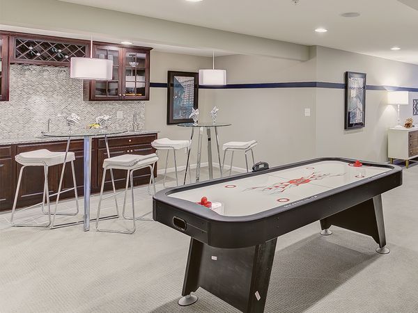 Basement man cave with countertop and sink