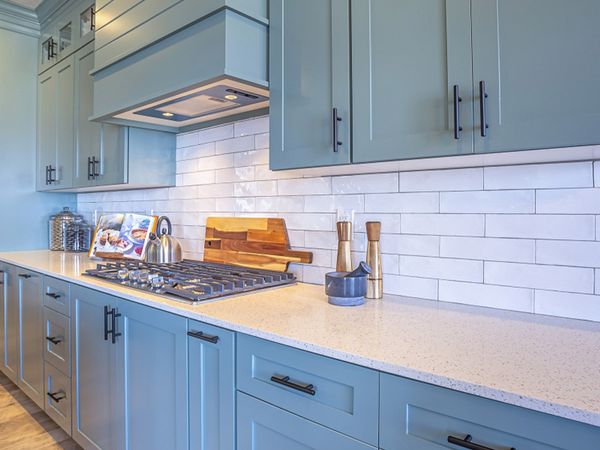 white countertop with blue-grey cabinets white countertop with blue-grey cabinets