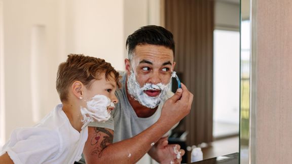 dad and son shaving in bathroom