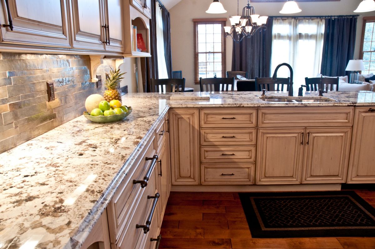 remodeled kitchen overlooking dining room with granite countertops