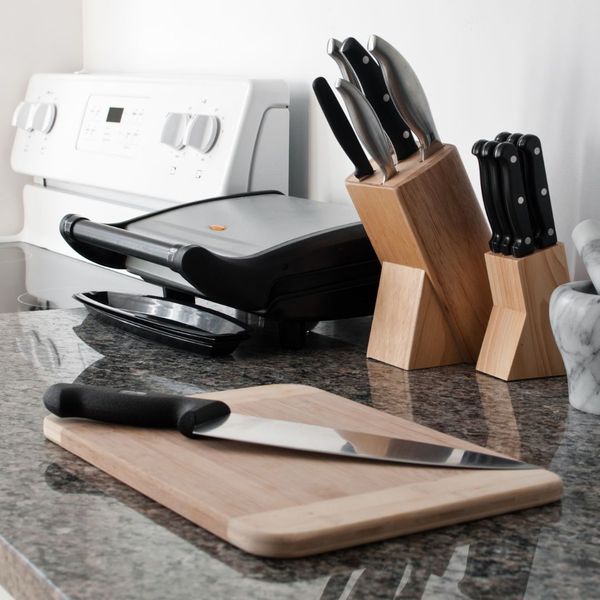 knives and cutting board on granite countertop