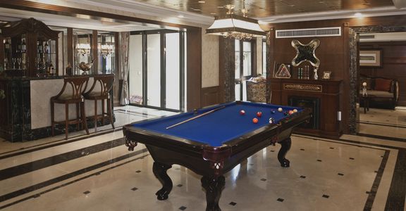 Man cave with granite bar and pool table