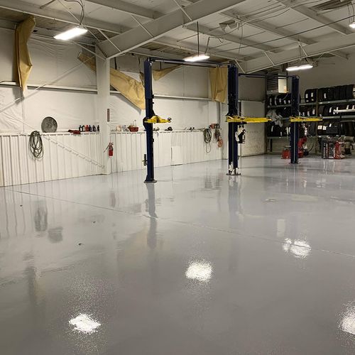 epoxied floor with car lifts