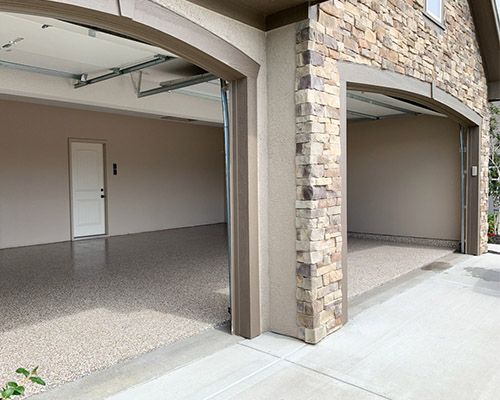 a garage with a stone wall and a stone wall