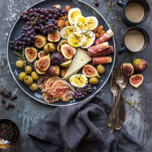 a plate of food with fruits and nuts