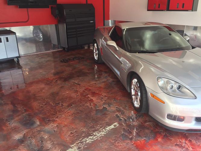 a silver sports car in a garage