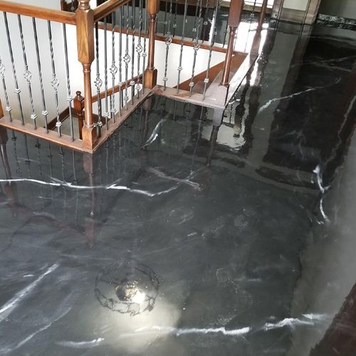 a black floor with a railing