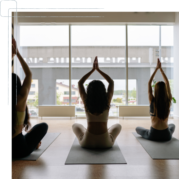 three women doing yoga three women doing yoga