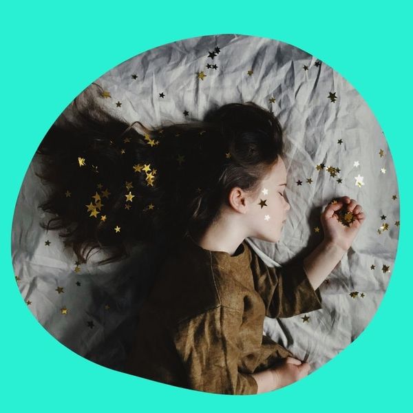 child asleep in bed