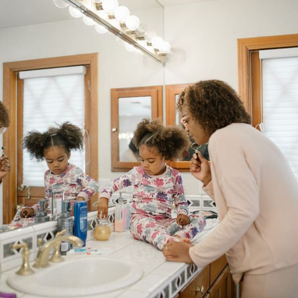 Mother and daughter in bathroom