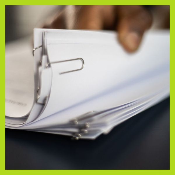a stack of documents What to Do When You Discover Water Damage in Your Home (2).jpg