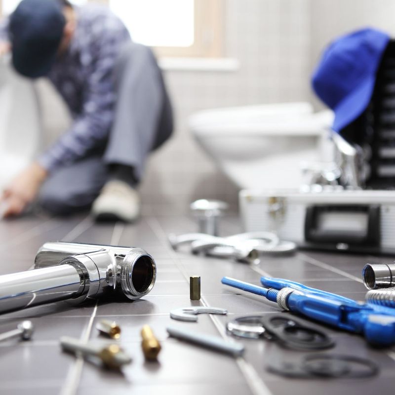 Plumber working on a bathroom repair